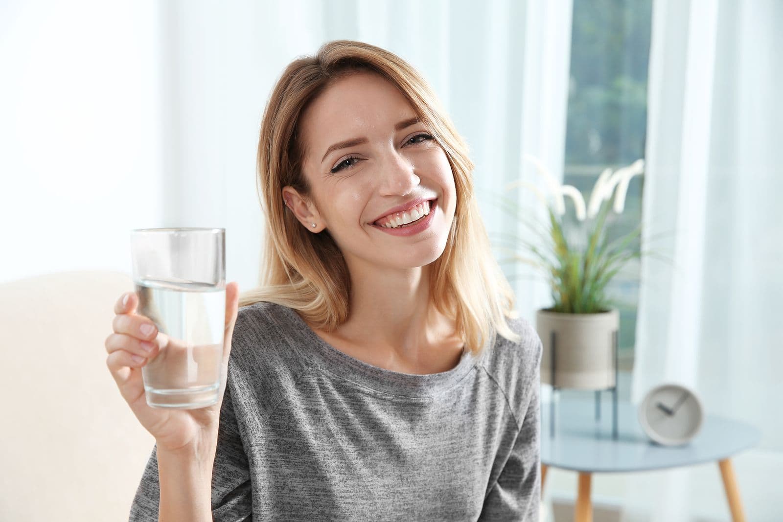 Fewa woman holding glass